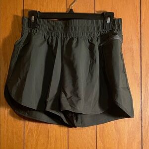 Dark green athletic shorts size medium